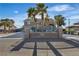 Two-story home with palm trees, gated entrance, and a long driveway at 131 Beesley Dr, Las Vegas, NV 89110