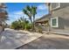 Side view of a home with a long driveway and low maintenance landscaping at 131 Beesley Dr, Las Vegas, NV 89110