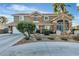 Attractive home featuring desert landscaping, a circular drive, and 3-car garage at 131 Beesley Dr, Las Vegas, NV 89110