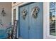 Charming double doors with wreaths and an inviting 'Welcome' sign at 131 Beesley Dr, Las Vegas, NV 89110