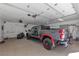 Oversized garage featuring a truck, ample lighting, and shelving providing plenty of storage and workspace at 131 Beesley Dr, Las Vegas, NV 89110