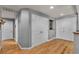 Hallway featuring hardwood floors, white doors, and neutral paint, creating a clean and modern aesthetic at 131 Beesley Dr, Las Vegas, NV 89110