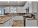 Well-lit kitchen with stainless steel appliances, granite countertops, and ample cabinet space at 131 Beesley Dr, Las Vegas, NV 89110