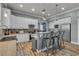 Modern kitchen with stainless steel appliances, granite countertops, and a breakfast bar at 131 Beesley Dr, Las Vegas, NV 89110