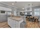 Open kitchen featuring a breakfast bar, stainless steel appliances, and an adjacent dining area at 131 Beesley Dr, Las Vegas, NV 89110