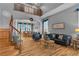Inviting living area featuring wood floors, staircase, and comfortable seating at 131 Beesley Dr, Las Vegas, NV 89110