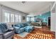 Bright main bedroom featuring hard wood floors, blue accent wall, sitting area and decorative furnishings at 131 Beesley Dr, Las Vegas, NV 89110
