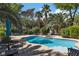 Private backyard with a refreshing swimming pool, hot tub, and comfortable seating areas for outdoor gatherings at 131 Beesley Dr, Las Vegas, NV 89110