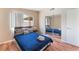 Bedroom with a large window with natural light and a mirrored closet at 1615 Palora Ave, Las Vegas, NV 89169