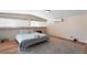Bedroom features wood-look floors and two large windows for natural light at 1615 Palora Ave, Las Vegas, NV 89169