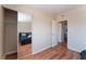 Bedroom with wood-look floors and a mirrored closet that provides ample storage space at 1615 Palora Ave, Las Vegas, NV 89169