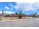 Single-story home with desert landscaping and wrought iron fence at 1615 Palora Ave, Las Vegas, NV 89169