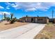 Inviting single-story home with a concrete driveway at 1615 Palora Ave, Las Vegas, NV 89169