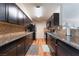 Modern kitchen with granite counters, wooden cabinets, and stainless steel appliances at 1615 Palora Ave, Las Vegas, NV 89169