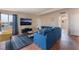 Living room featuring a comfortable couch and large TV at 1615 Palora Ave, Las Vegas, NV 89169