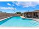 Inviting pool with steps, large patio, and covered area for relaxation at 1615 Palora Ave, Las Vegas, NV 89169