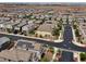 Neighborhood aerial view of community showcasing solar panels on roofs at 169 Volti Subito Way, Henderson, NV 89011