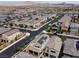 An aerial view of a suburban neighborhood with houses and street at 169 Volti Subito Way, Henderson, NV 89011