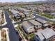 Overhead view of a residential neighborhood showcasing various home exteriors and street layout with scenic mountain backdrop at 169 Volti Subito Way, Henderson, NV 89011