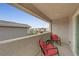 Cozy balcony featuring comfortable seating and a scenic view of the surrounding neighborhood at 169 Volti Subito Way, Henderson, NV 89011