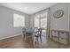 Cozy dining area features wood-look tile and sliding glass doors to the backyard at 169 Volti Subito Way, Henderson, NV 89011