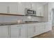 Bright kitchen featuring sleek white cabinets, subway tile backsplash, and stainless steel appliances at 169 Volti Subito Way, Henderson, NV 89011