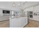 Modern open-concept kitchen featuring stainless appliances and granite countertop island at 169 Volti Subito Way, Henderson, NV 89011