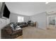Spacious loft area featuring neutral carpet and an entertainment center with mounted TV at 169 Volti Subito Way, Henderson, NV 89011