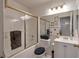 Cozy bathroom with a shower and bathtub combination, vanity with sink, and a modern toilet at 1911 Winter Hill St, Las Vegas, NV 89106