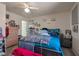 Bright bedroom with a queen bed, ceiling fan, and stylish wall decor creating a relaxing atmosphere at 1911 Winter Hill St, Las Vegas, NV 89106