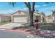 Charming single-story home featuring a well-maintained front yard and attached two-car garage at 1911 Winter Hill St, Las Vegas, NV 89106