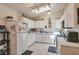 Bright kitchen with white cabinetry, tile flooring, and updated appliances at 1911 Winter Hill St, Las Vegas, NV 89106