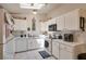 Well-lit kitchen featuring white cabinets, updated appliances and plenty of counter space at 1911 Winter Hill St, Las Vegas, NV 89106