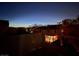 Outdoor balcony with a metal railing and a view of the neighborhood at twilight at 214 Bella Matese Ave, Las Vegas, NV 89183