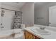 Bright bathroom features a shower-tub combo with decorative curtain and a vanity with a sink at 214 Bella Matese Ave, Las Vegas, NV 89183