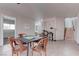 Inviting dining area with a game table, nearby bathroom, and a view of the staircase at 214 Bella Matese Ave, Las Vegas, NV 89183