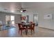Bright dining area with tile floors, a ceiling fan, and easy access to the outdoor patio at 214 Bella Matese Ave, Las Vegas, NV 89183