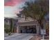 Stunning exterior elevation featuring a driveway leading to a two-car garage at 214 Bella Matese Ave, Las Vegas, NV 89183