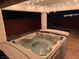 Outdoor hot tub under covered patio is perfect for nighttime relaxation at 214 Bella Matese Ave, Las Vegas, NV 89183
