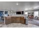 Stylish kitchen with modern cabinets and views to dining and living areas at 214 Bella Matese Ave, Las Vegas, NV 89183