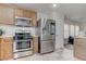 Modern kitchen featuring stainless steel appliances and natural light at 214 Bella Matese Ave, Las Vegas, NV 89183