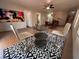 Modern living area featuring tile floors and contemporary decor at 214 Bella Matese Ave, Las Vegas, NV 89183