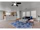 Bright living room with large windows, a modern rug, and stylish furniture providing a cozy atmosphere at 214 Bella Matese Ave, Las Vegas, NV 89183
