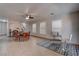 Open living area with tile floors, ceiling fan, and natural light at 214 Bella Matese Ave, Las Vegas, NV 89183