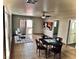 Open living space with tile flooring, patio access, and a view of multiple rooms at 214 Bella Matese Ave, Las Vegas, NV 89183