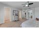 Spacious main bedroom featuring a ceiling fan and ensuite bathroom at 214 Bella Matese Ave, Las Vegas, NV 89183
