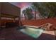 Inviting pool with integrated spa and rock waterfall feature at 214 Bella Matese Ave, Las Vegas, NV 89183