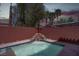 A cozy pool with a stunning rock waterfall feature enhancing the outdoor space at 214 Bella Matese Ave, Las Vegas, NV 89183