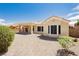 Beautiful backyard with a covered patio, desert landscaping, and block wall fencing offering great privacy at 2205 Beacon Ridge Dr, Las Vegas, NV 89134