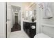 Bathroom featuring a dark vanity with black countertop, white toilet, and tile flooring at 2205 Beacon Ridge Dr, Las Vegas, NV 89134